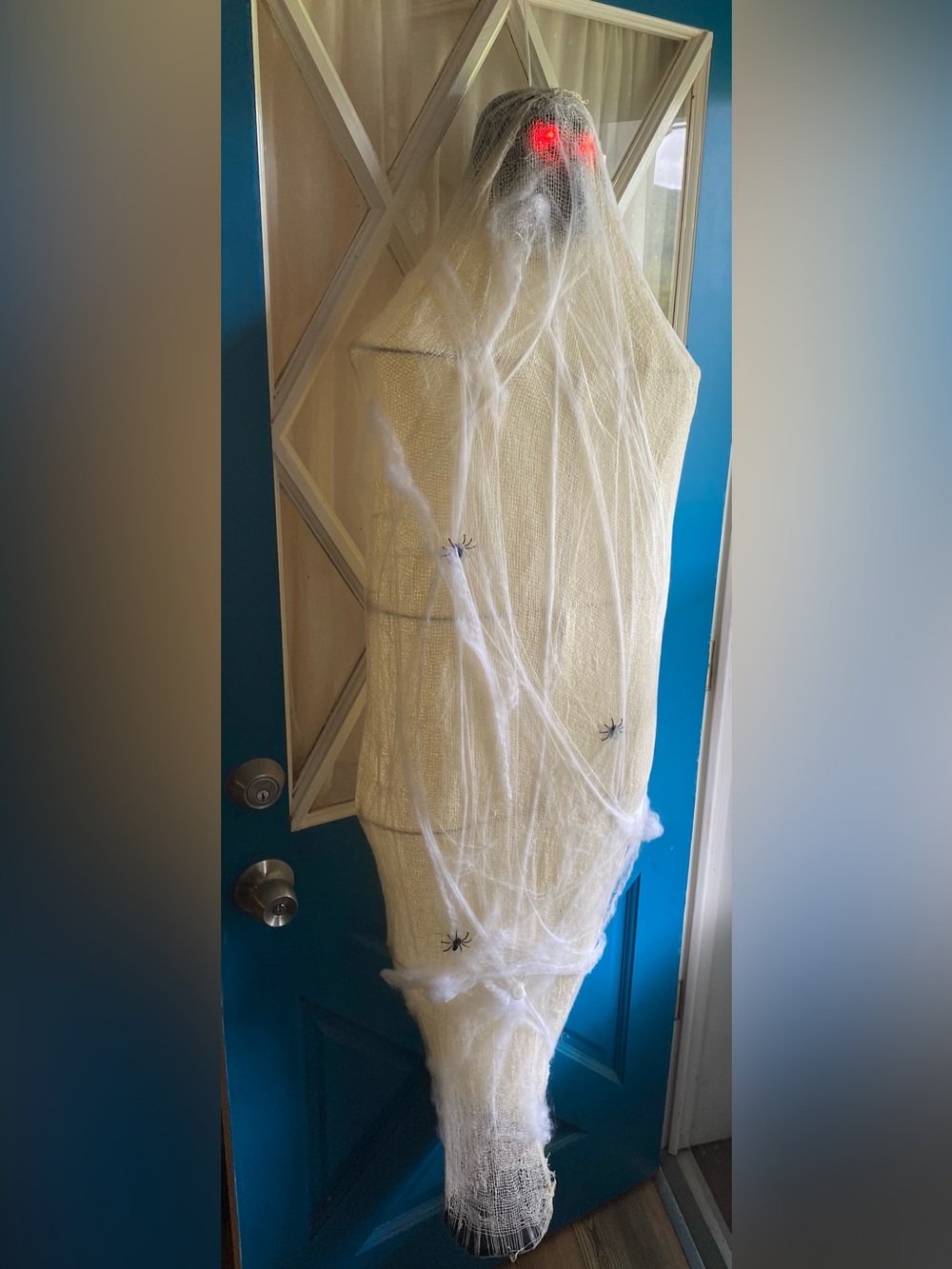 Animated Cocooned Hanging Man Halloween Decoration - he asks to be let out